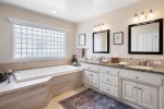 Master bath with luxurious tub.